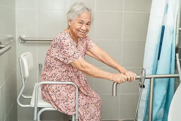 Safety handrails installed in a bathroom by Home Help Network